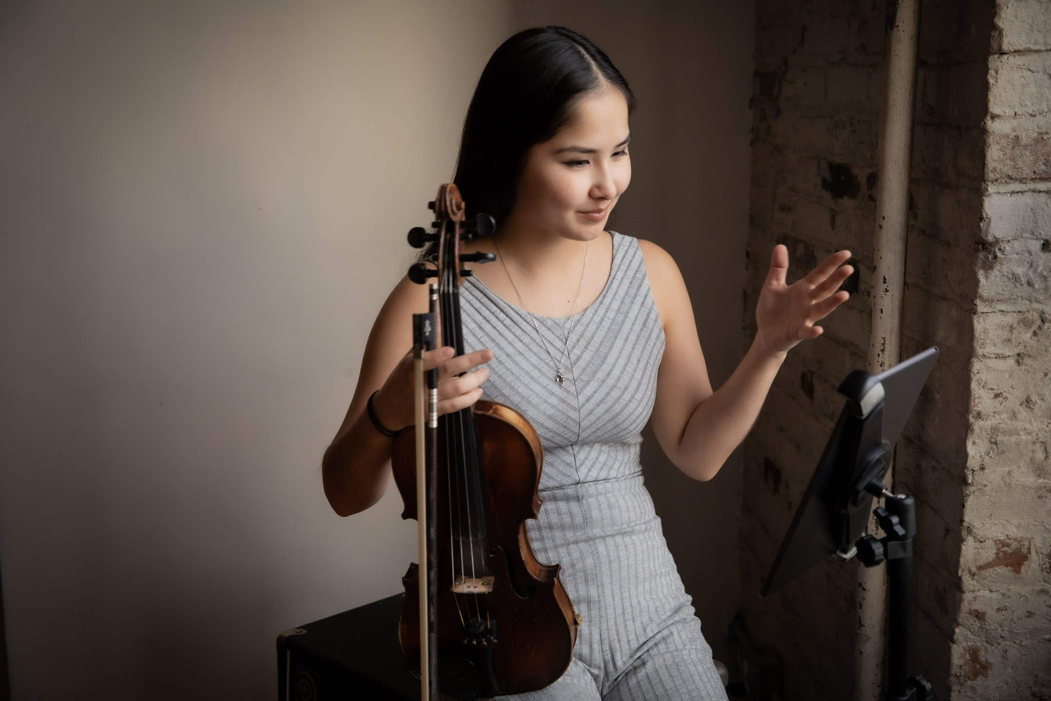 Woman playing violin.